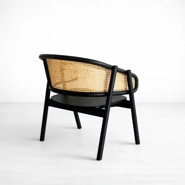 INTERIORZE Nero teakwood cane lounge arm chair with natural cane wrap back and matte black finish
