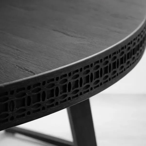 Close-up of textured edge detail on INTERIORZE Nero Crest round dining table