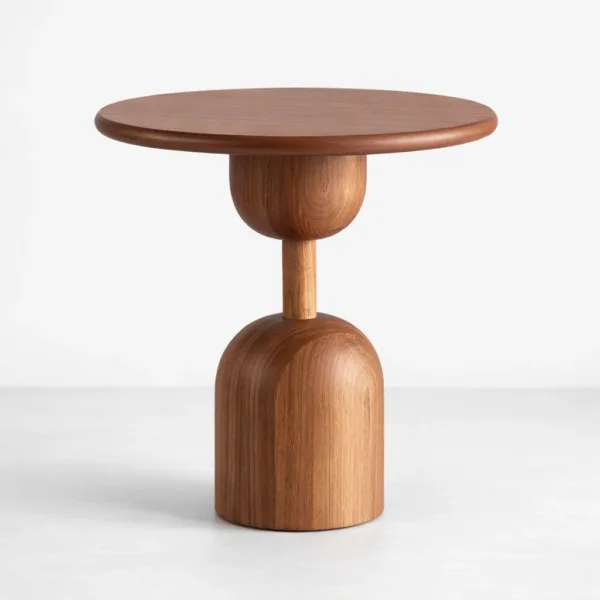 Handcrafted teakwood side table with round top and sculptural pedestal base by INTERIORZE