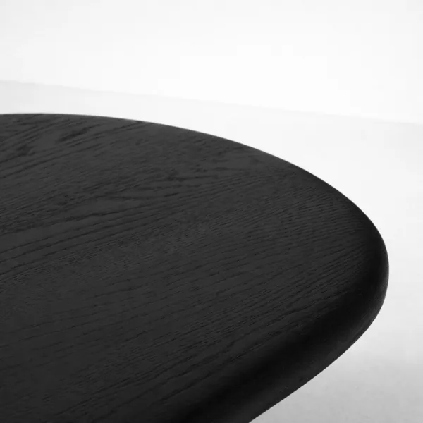 INTERIORZE teakwood oval coffee table with sculpted legs in black finish