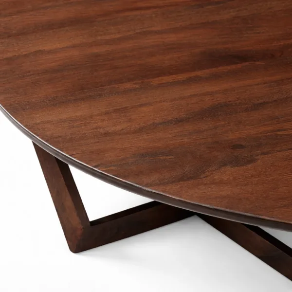 INTERIORZE teakwood oval center table with sculptural cross base in dark walnut finish