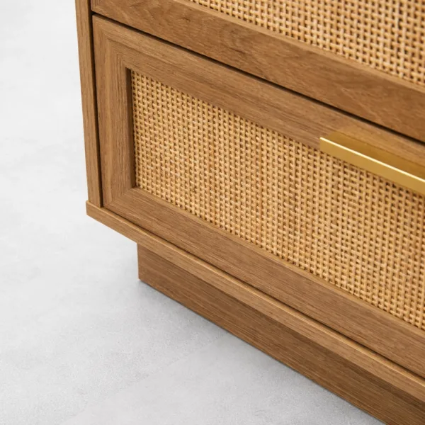 close-up of cane drawer front and brass handle on INTERIORZE teak wood chest of drawers