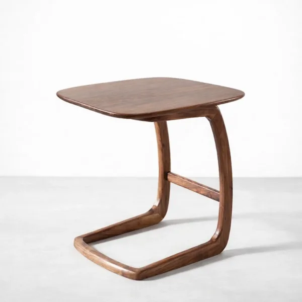 Handcrafted teakwood side table with rounded square top and cantilever base by INTERIORZE