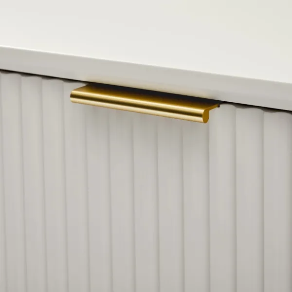 Close-up of the brushed gold handle and fluted door detail of the Pearl Fluted teak wood media console