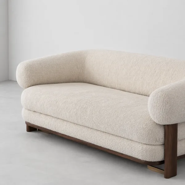 INTERIORZE cream boucle sofa with rounded arms and dark wood legs
