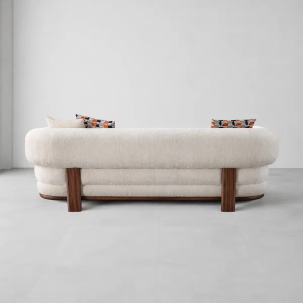 INTERIORZE cream boucle sofa with rounded arms and dark wood legs