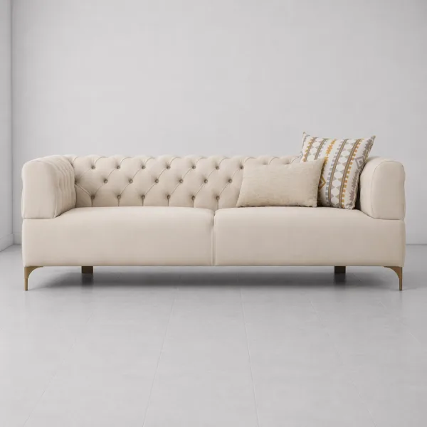 INTERIORZE tufted cream sofa with gold-toned legs and soft upholstery