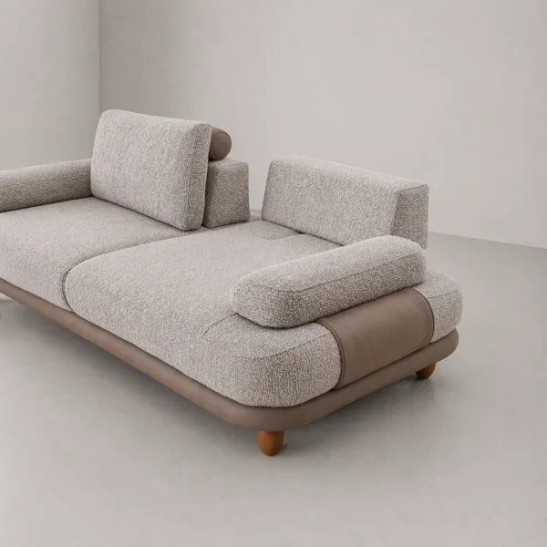 INTERIORZE greige boucle sofa with rounded arm pads and layered base detail