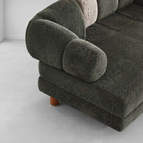 INTERIORZE dark green boucle sofa with rounded arms and wooden legs