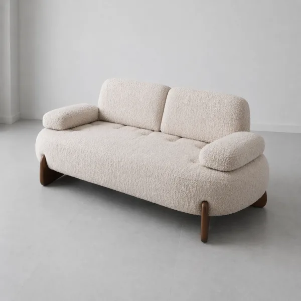 INTERIORZE cream boucle sofa with rounded shape and wooden legs