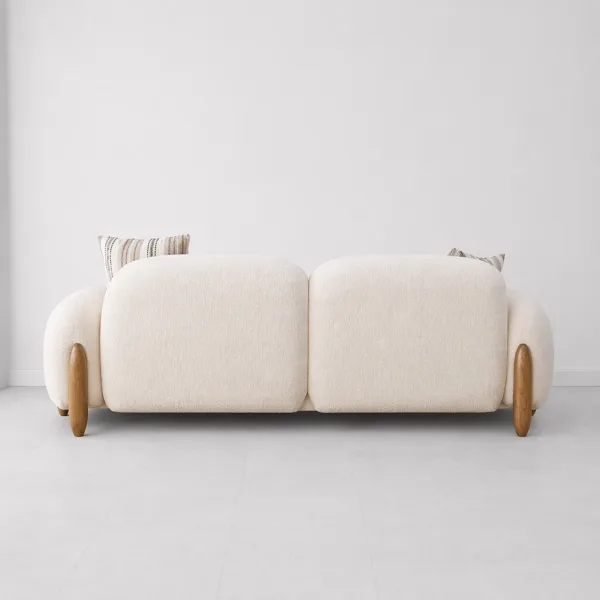 INTERIORZE cream boucle sofa with rounded arms and wooden side accents