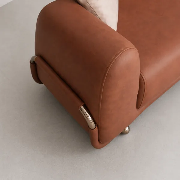 INTERIORZE cognac leatherette sofa with rounded arms and metal accent legs