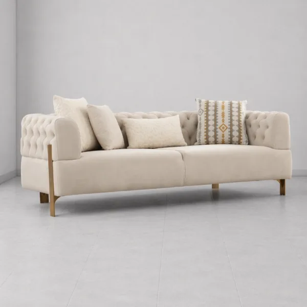 INTERIORZE tufted cream sofa with gold-toned legs and soft upholstery
