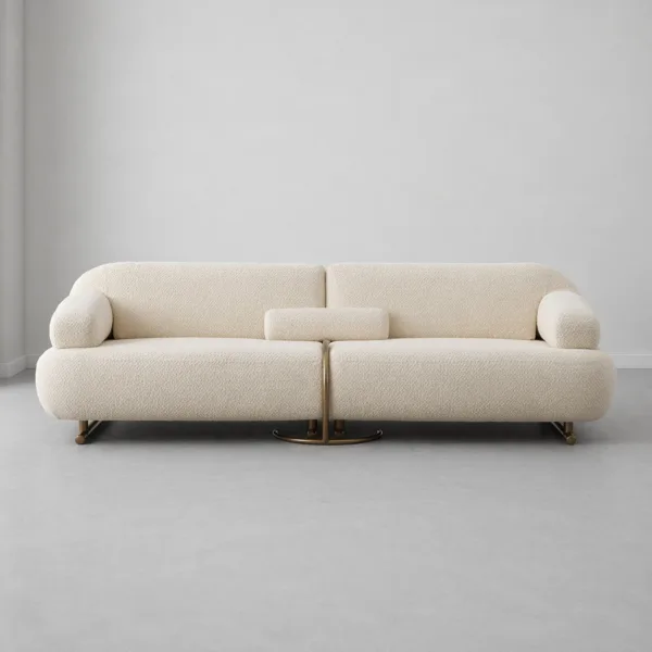 INTERIORZE cream boucle sofa with sculpted curved arms and brass-toned base