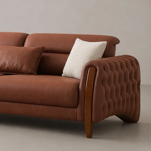 INTERIORZE tan leather sofa with tufted arms and wooden side accents