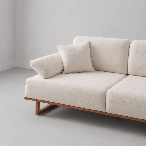 INTERIORZE white boucle sofa with wooden base and pillow armrests