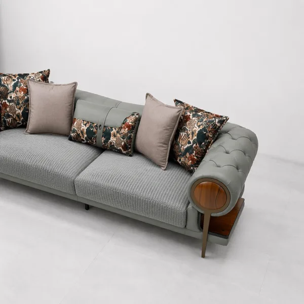 INTERIORZE grey fabric sofa with tufted round arms and wooden side shelves