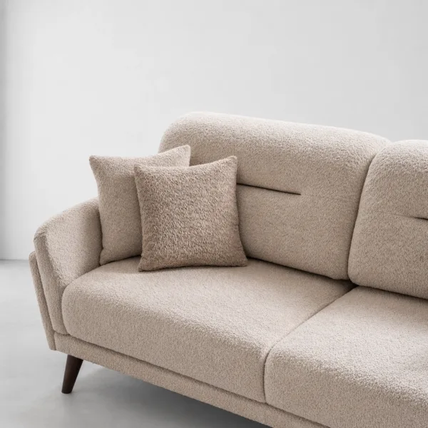 INTERIORZE cream boucle sofa with curved arms and wooden legs