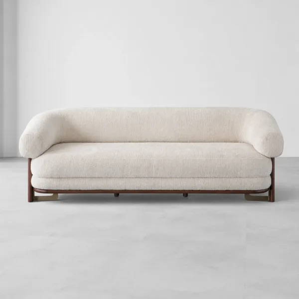 INTERIORZE cream boucle sofa with rounded arms and dark wood legs