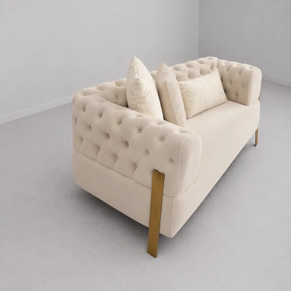 INTERIORZE tufted cream sofa with gold-toned legs and soft upholstery