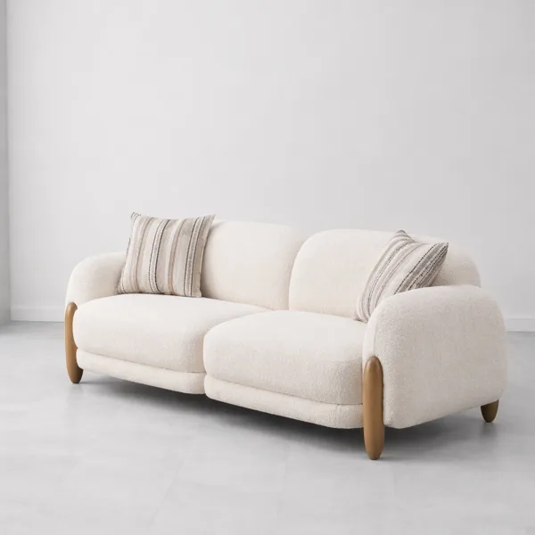 INTERIORZE cream boucle sofa with rounded arms and wooden side accents