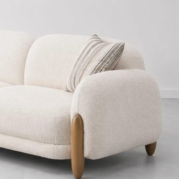 INTERIORZE cream boucle sofa with rounded arms and wooden side accents