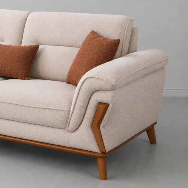 INTERIORZE cream fabric sofa with wooden accents and rust pillows