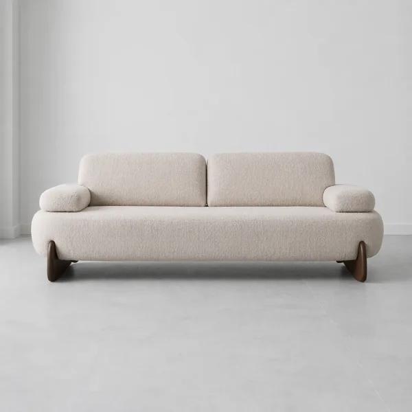 INTERIORZE cream boucle sofa with rounded shape and wooden legs