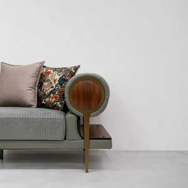 INTERIORZE grey fabric sofa with tufted round arms and wooden side shelves