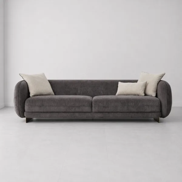 INTERIORZE charcoal designer sofa with black side panels and gold-toned base