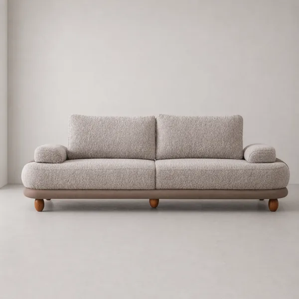INTERIORZE greige boucle sofa with rounded arm pads and layered base detail