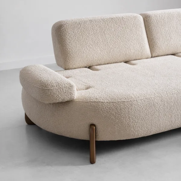 INTERIORZE cream boucle sofa with rounded shape and wooden legs