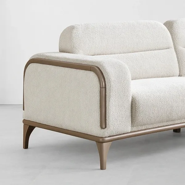 INTERIORZE cream boucle sofa with bronze metal frame and rounded arms