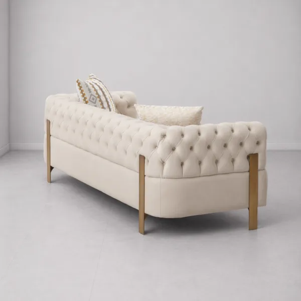 INTERIORZE tufted cream sofa with gold-toned legs and soft upholstery